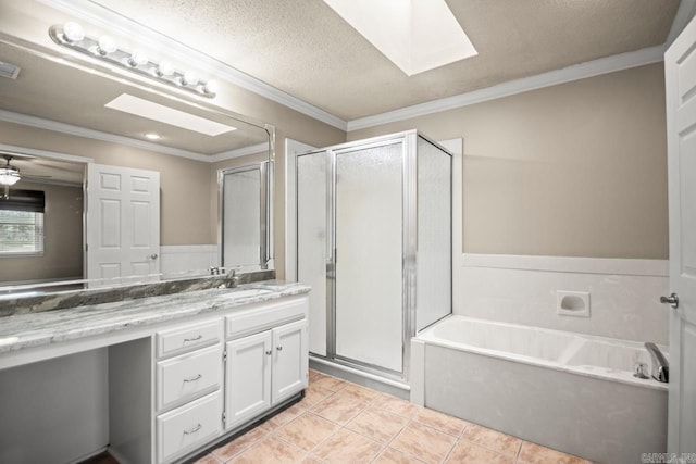 bathroom featuring a skylight, tile patterned flooring, vanity, separate shower and tub, and crown molding