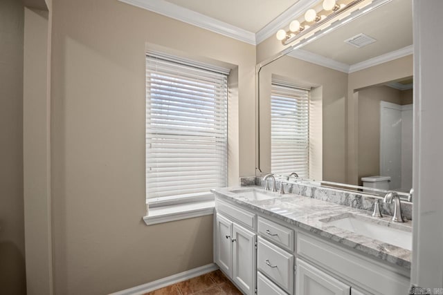 bathroom featuring vanity, tile patterned flooring, ornamental molding, and toilet