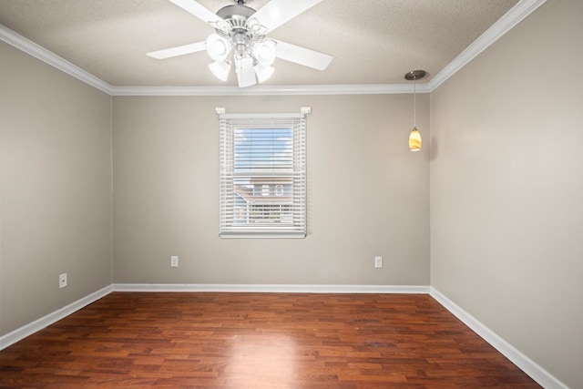 empty room featuring a textured ceiling, ornamental molding, dark hardwood / wood-style floors, and ceiling fan