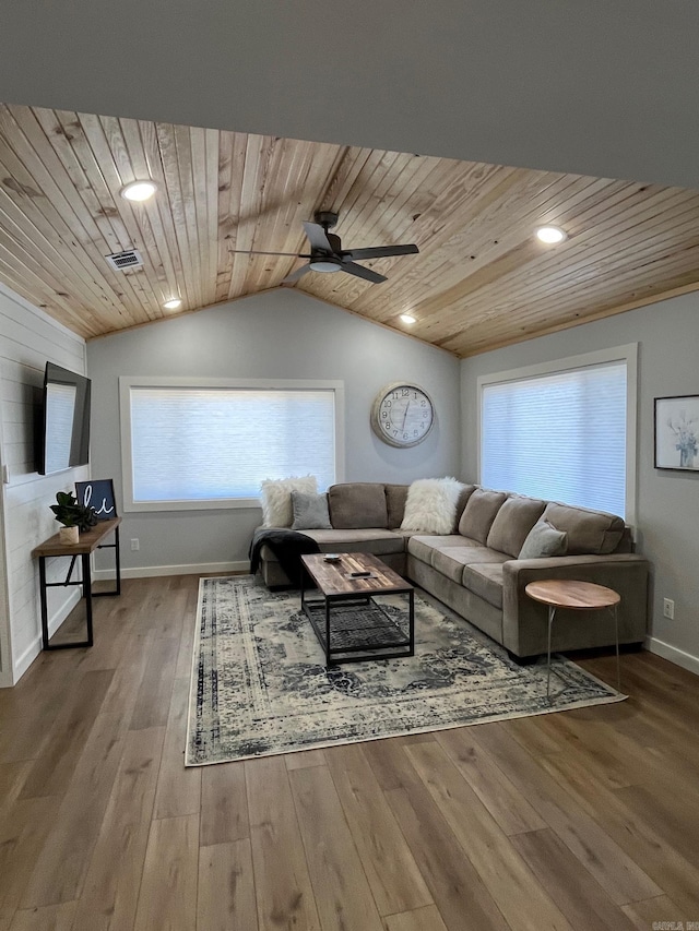 living room with wood-type flooring, vaulted ceiling, ceiling fan, and wood ceiling