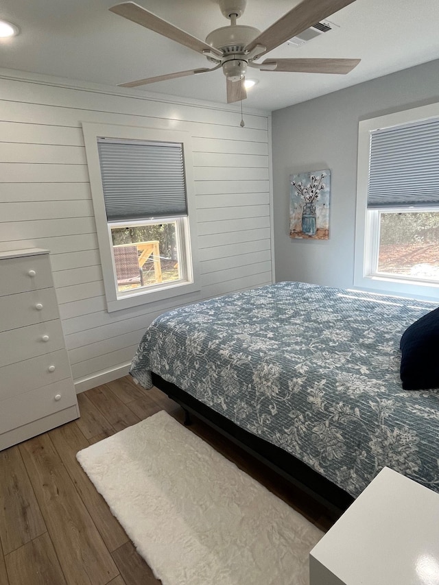 bedroom featuring hardwood / wood-style floors and ceiling fan