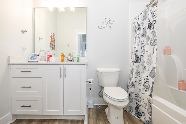 full bathroom with vanity, hardwood / wood-style floors, shower / tub combo, and toilet