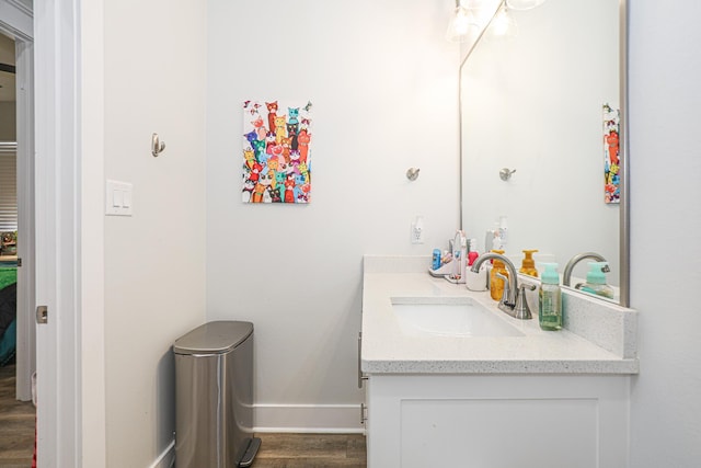 bathroom featuring hardwood / wood-style flooring and vanity