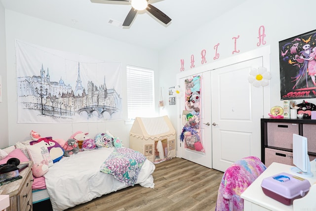 bedroom with ceiling fan, hardwood / wood-style floors, and a closet