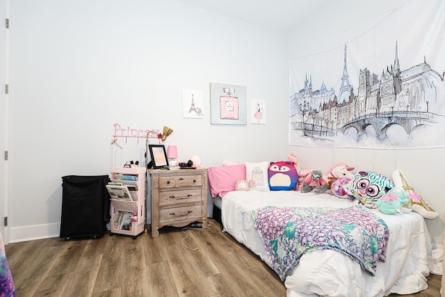 bedroom with hardwood / wood-style floors