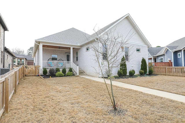 view of front facade with covered porch and a front lawn