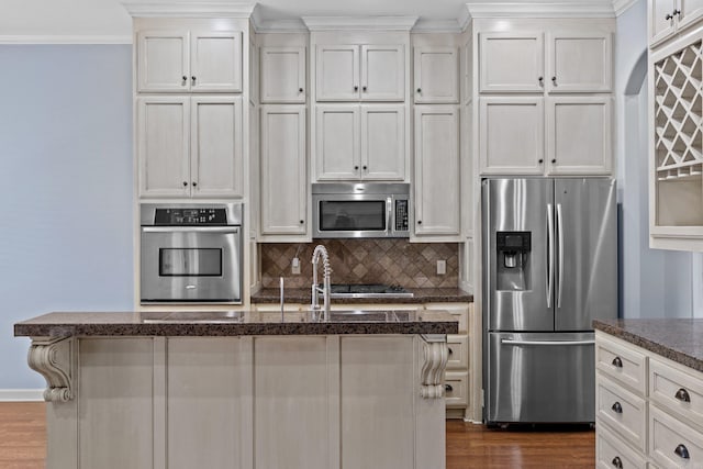 kitchen with dark hardwood / wood-style floors, a center island, white cabinets, and appliances with stainless steel finishes