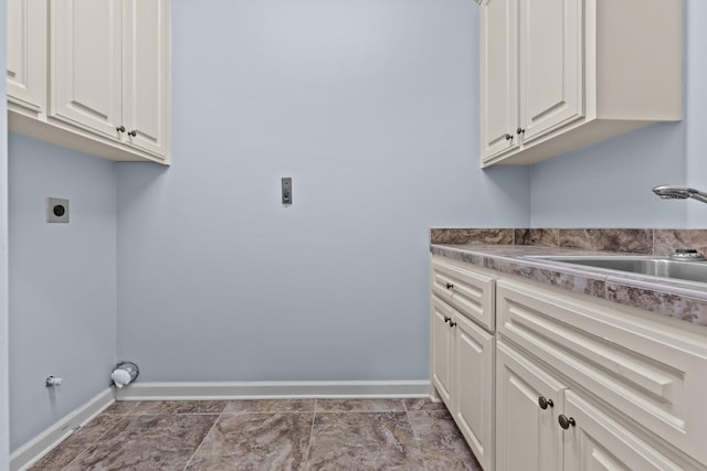 laundry room with cabinets, sink, and hookup for an electric dryer