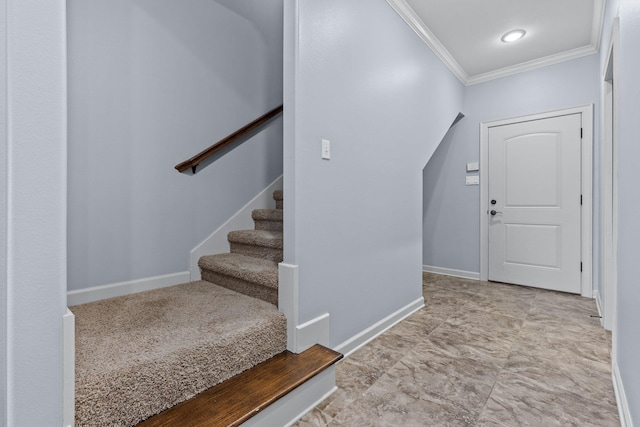 foyer entrance featuring crown molding