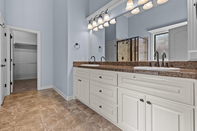 bathroom with vanity and walk in shower