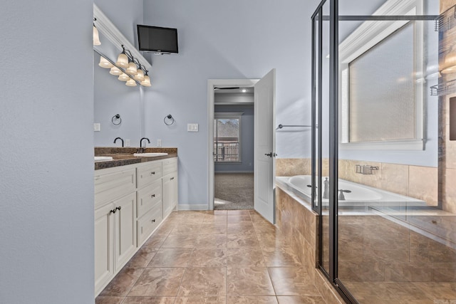 bathroom featuring vanity and separate shower and tub