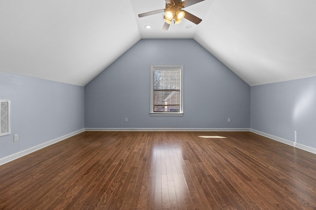 additional living space featuring ceiling fan, lofted ceiling, and dark hardwood / wood-style flooring