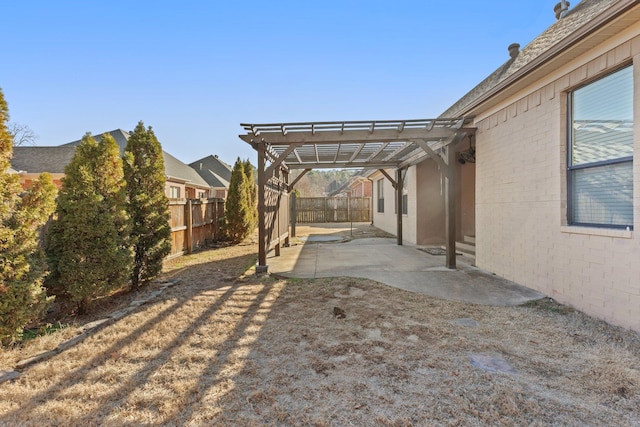 view of yard with a pergola and a patio