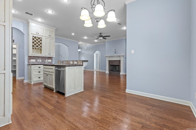 kitchen featuring pendant lighting, ceiling fan, dishwasher, and white cabinets