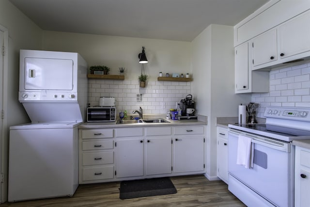 kitchen with white cabinetry, white electric range, and sink