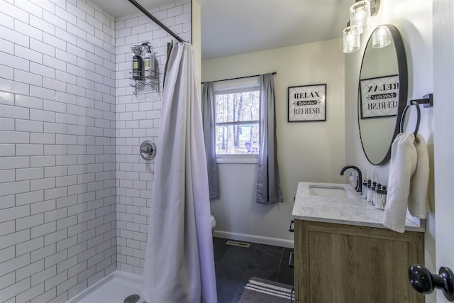 bathroom with walk in shower, vanity, and toilet