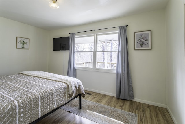 bedroom featuring wood-type flooring