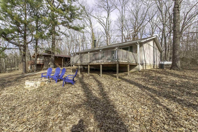 back of property featuring a wooden deck