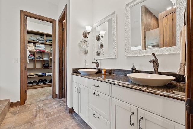 bathroom featuring vanity and walk in shower