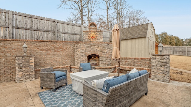 view of patio / terrace featuring an outdoor living space with a fireplace