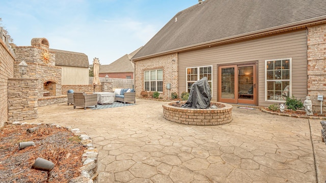 view of patio featuring an outdoor living space with a fireplace