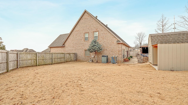 rear view of house featuring central AC unit