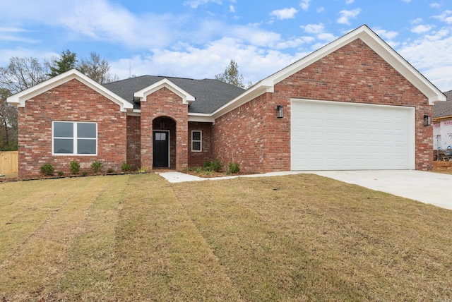 view of front facade with a garage and a front lawn