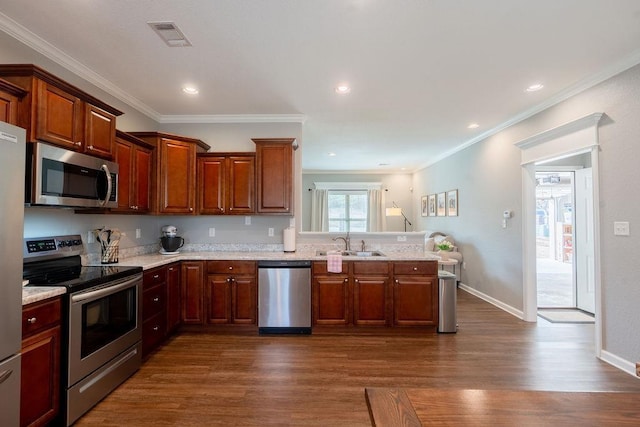 kitchen with sink, ornamental molding, dark hardwood / wood-style floors, stainless steel appliances, and light stone countertops