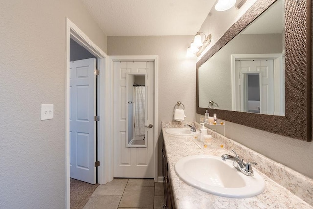 bathroom with vanity and tile patterned flooring