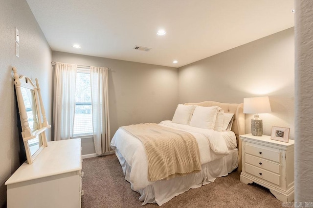 bedroom featuring light carpet