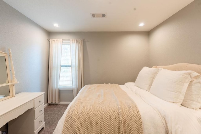 bedroom featuring dark colored carpet