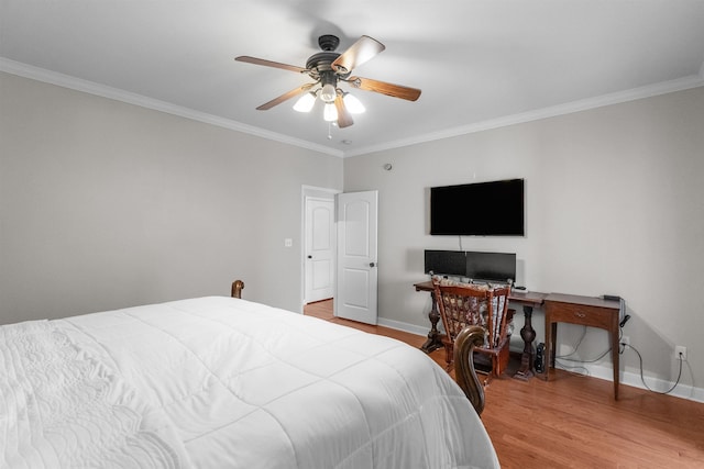 bedroom featuring light hardwood / wood-style flooring, ornamental molding, and ceiling fan