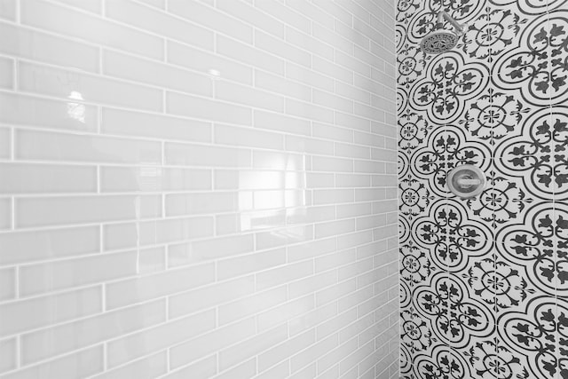 bathroom with a tile shower