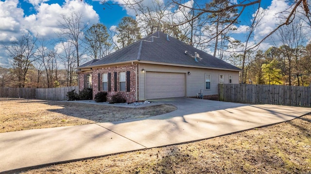 view of side of home featuring a garage