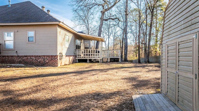 view of property exterior featuring a wooden deck