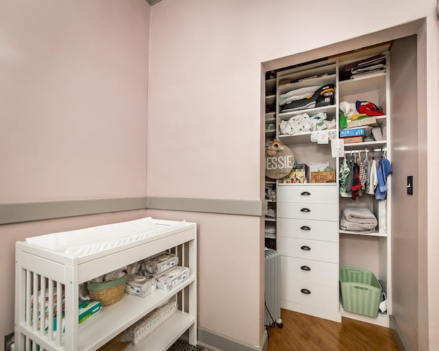 closet featuring radiator heating unit