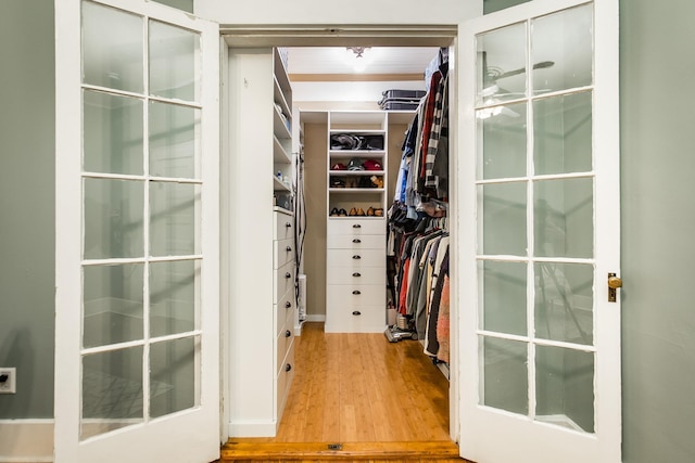 spacious closet featuring hardwood / wood-style flooring