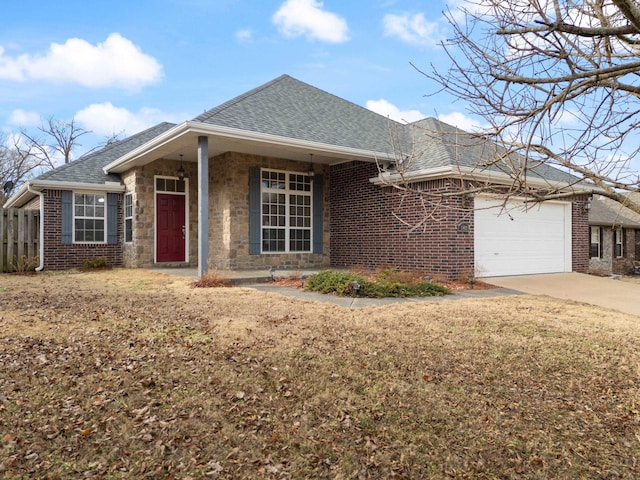 ranch-style home featuring a garage and a front lawn