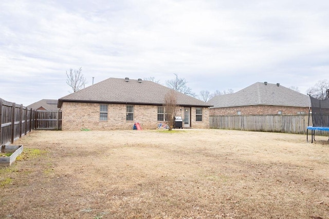 back of property with a trampoline