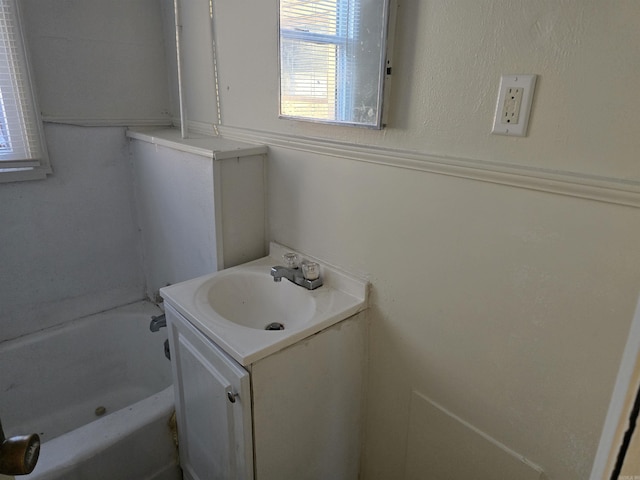 bathroom featuring vanity and a bathing tub