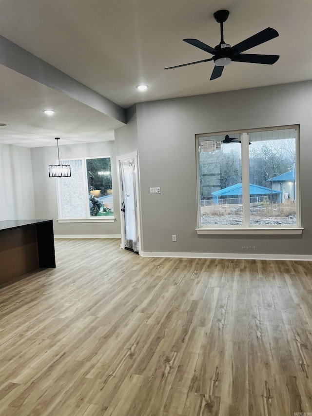 interior space featuring light hardwood / wood-style floors and ceiling fan