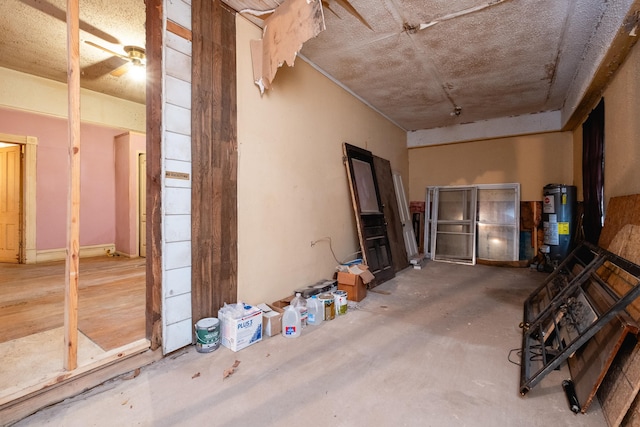 misc room with concrete flooring and gas water heater