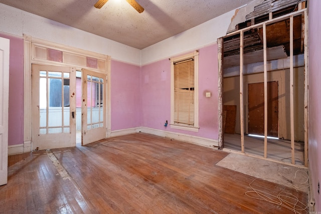 spare room featuring ceiling fan and wood-type flooring