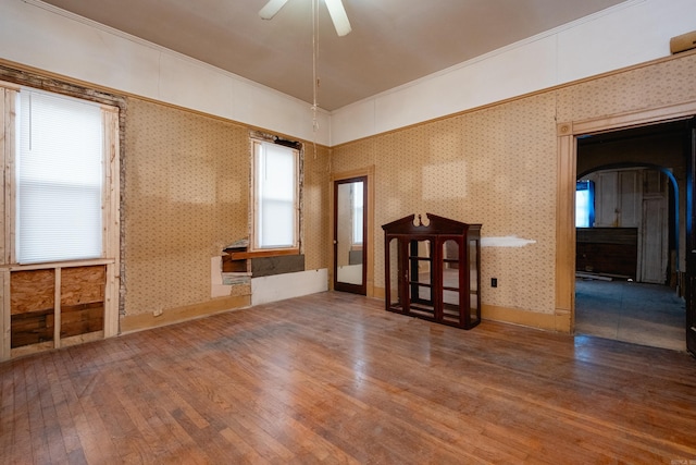 empty room featuring hardwood / wood-style flooring and ceiling fan