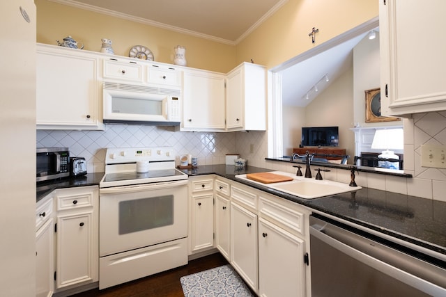 kitchen featuring sink, ornamental molding, white cabinets, and appliances with stainless steel finishes