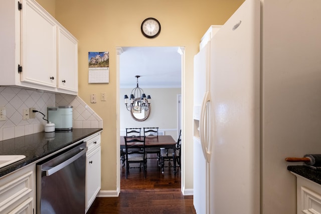 kitchen featuring dark wood-type flooring, dishwasher, dark stone countertops, backsplash, and white cabinets