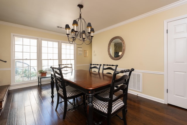 dining area with dark hardwood / wood-style flooring, a notable chandelier, and crown molding