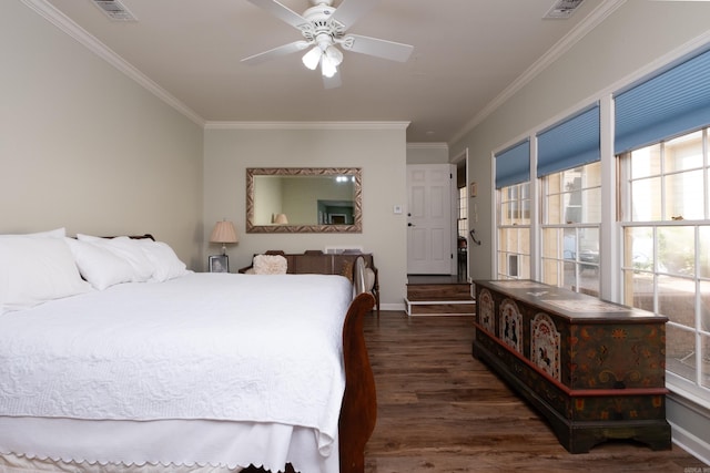 bedroom featuring dark hardwood / wood-style flooring, ornamental molding, and ceiling fan