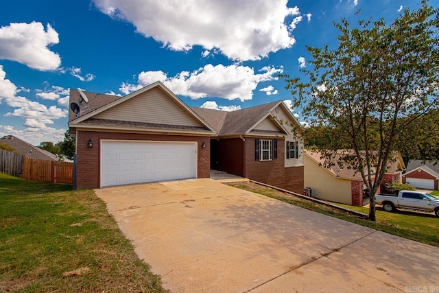 view of front of house featuring a garage and a front yard