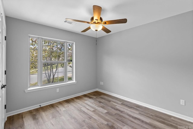 empty room featuring light hardwood / wood-style flooring and ceiling fan